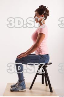 Sitting pose blue jeans pink t shirt of Oxana …